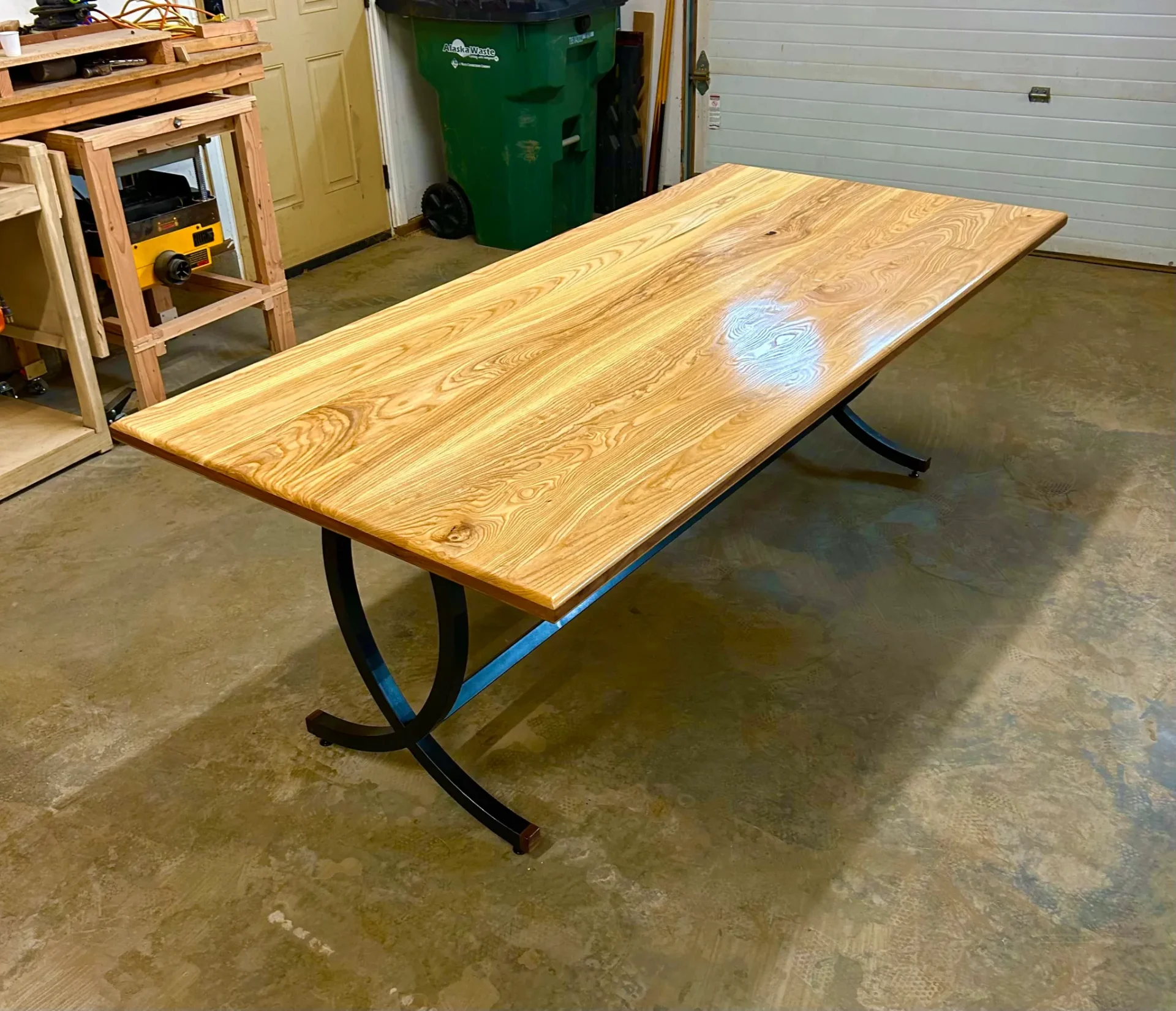Custom metal fabrication steel table base with wood Alaska Table Makers